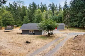 The home sits on a gentle slope that can be terraced more than it already is. There is room for Rvs, boats, toys, whatever you would like when you don't have an HOA.