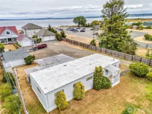 The home is situated just off Point No Point road and next door to extra parking for the beach/light house. The three homes share the access easement along the fence.