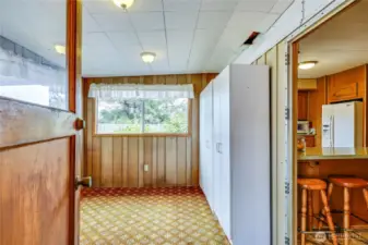 Entrance from the rear porch with storage and access through the kitchen.