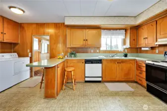 Another view of the kitchen back out to the entry,