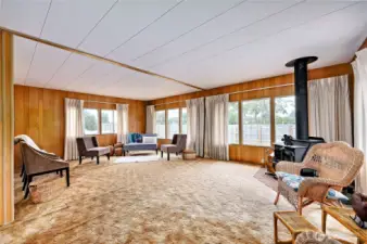 Large living room with lots of windows for great lighting.