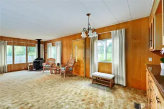 Corner wood stove. Dry wood pile on the back patio. The home also has an electric furnace/duct system.