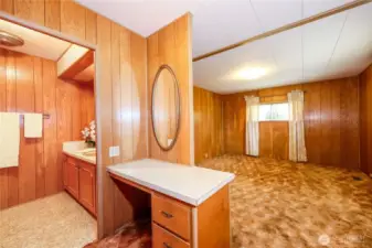 Primary bedroom at the end of the hall with attached .75 bath and vanity.