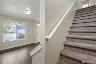 Stairs to upstairs and notice, NEW carpets continuing through out the upper level.