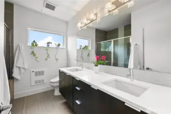 Upper bathroom with double vanity and huge shower.