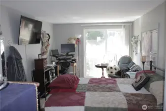 Primary bedroom with a slider to the back yard.