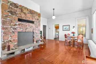 The dining room and living room flank the fireplace - it's a cozy space with an amazing view.