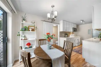 Bright dining area looks out to the private patio.