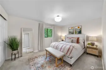 Spacious primary bedroom with roomy closet.