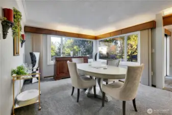 Dining room w/large windows & plenty of natural light.