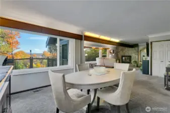 Corner view of dining room showing open flow to living area.