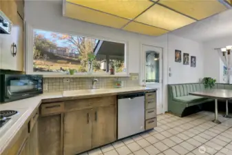 Kitchen showing the door that leads to the back covered porch.
