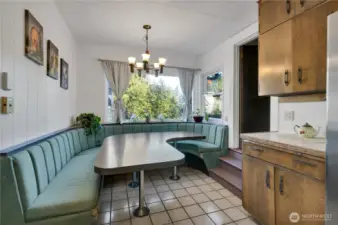 harming built-in breakfast nook; stairs on right lead to the 3 upstairs bedrooms.