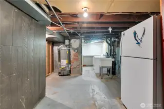 Basement w/laundry area, utility sink & lots of hidden storage space.