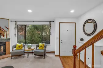 Entry features new can lighting and hard surfaces to help keep you newly installed carpet clean. The interior was recently painted and the wood burning fireplace makes a great focal point.