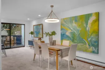 Dining space is centralized to the kitchen and living room.  Contemporary lighting makes the space feel warm and inviting.  You'll feel excited to entertain in this space with room for all.