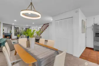 The dining room is central to the living room and kitchen. Closet can be used for coats and other items. There is a powder room left of the mirror that makes it convenient for you and your guests.