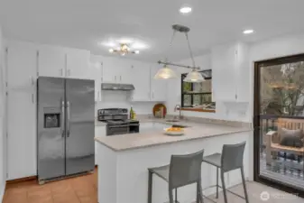 Updated kitchen with newer appliances, quartz counter, new lighting and subway tile.  Garden window to grow your fresh herbs and let tons of light into the kitchen. Tons of cabinet and counterspace.  A great gathering space.