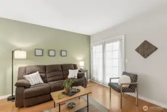 Living room area with French doors to private deck - view of Olympic mountains and sunsets!