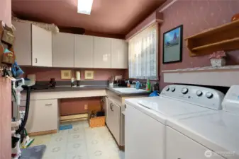 Big Laundry Room With Sink and Pantry.