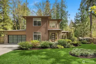 Sleek lines and a contemporary garage create a strong first impression, with a spacious driveway and thoughtful design throughout.