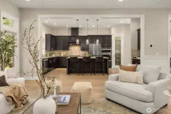 Open-concept living room with wide-plank hardwood floors, modern gas fireplace, and clean architectural lines—designed for comfortable everyday living and effortless entertaining.