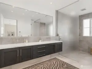 A spa-inspired ensuite bath complements the primary suite