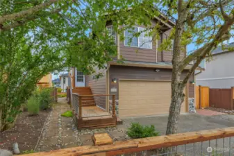 Front porch with easy access to the back yard through the open gate.