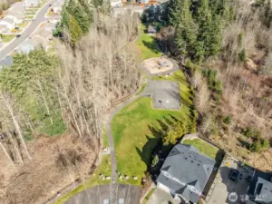 Community Amenities – Summerwood Park features a sports court, playground, paths, picnic area, and open lawns.