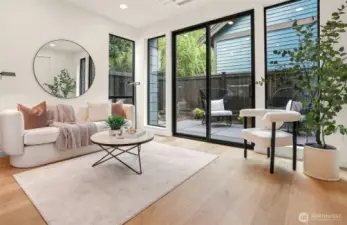 Oversized Windows and Sliding Glass Doors invite the outside in!