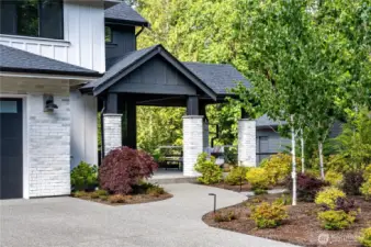 Welcoming covered, generous entry w/covered patio area.