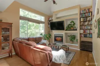 Massive windows allow lots of natural light.  Gas fireplace and decorative nooks.
