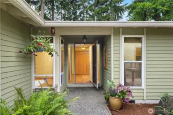 Welcoming and bright entrance, with flanking windows.