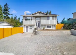 Welcome Home! New roof, lots of parking and very low maintenance yard