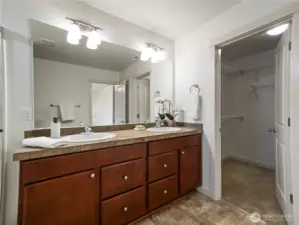 The primary bathroom includes a nice, walk-in closet and linen closet for extra storage.