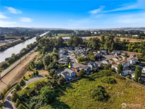 Kelsey Lane is a small community of 49 homes nestled among mature trees and open spaces, with sidewalks, streetlights, a small park with playground and bordered by the Puyallup River to the south.