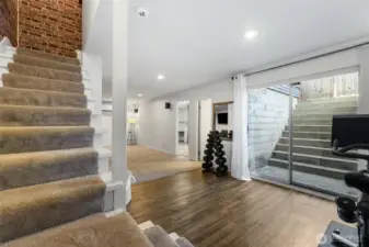 “Fully finished basement with private entrance, bar area, rec room, and bonus room—ideal for office or guest space.”
