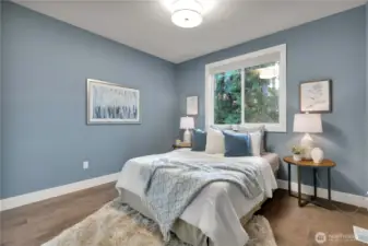 One of two additional bedrooms.  Remote blinds; engineered hardwood flooring.  Cozy yet spacious!  Full bath just next door!