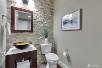 Powder room for guests easily accessed from Great Room.  9' ceilings, even in here!