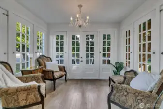 Sunroom with French doors that open to the side deck