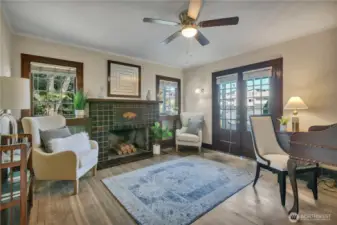 Main-level bedroom/den with rich millwork, & French doors to outdoors.