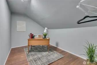 Upper-level office or bonus room. There's a hidden room behind the wall - room to expand?