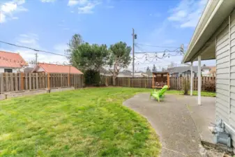 A charming spot in the rear yard provides space for a garden adding both beauty and functionality.