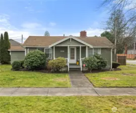 A cozy and inviting Craftsman features a covered porch where you can sit and enjoy the outdoors or greeting your guests.