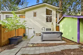 The hot tub and Studio are in a separate fenced area of the backyard.