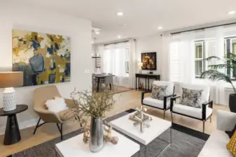 Bright and welcoming main level with wide-plank white oak flooring and large windows throughout.