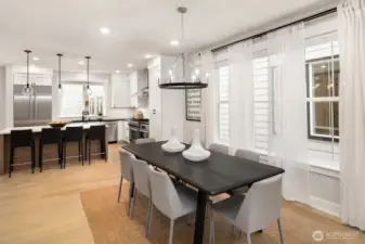 Oversized quartz island with seating creates the perfect centerpiece for cooking, dining, and conversation.