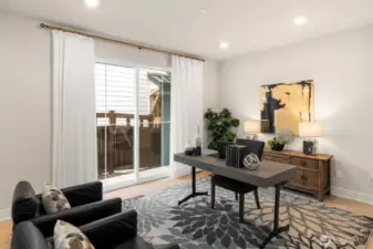 Versatile lower-level room ideal for a home office, gym, or media space.