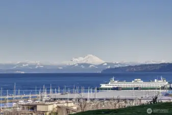 Welcome…soak in captivating views of Puget Sound, shimmering city lights, and majestic Mount Baker from this exceptional home.