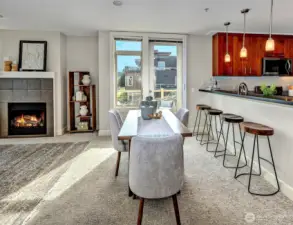 Entertain with ease: dining area opens via French door to a sprawling, sunlit deck, creating a wonderful extension of living space.